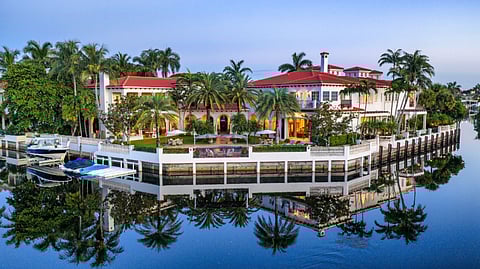 Aerial view of 799 Sanctuary Drive showing waterfront estate and yacht dock