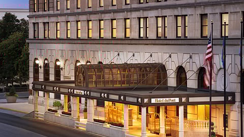 Hotel du Pont exterior with glass canopy and lit entryway