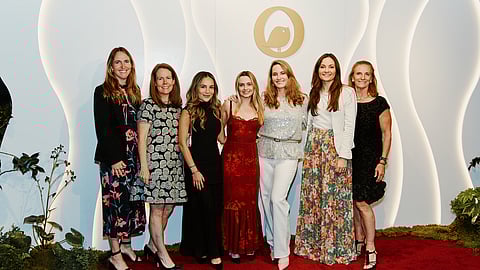 Group of women posing on red carpet at The Chick Mission Gala