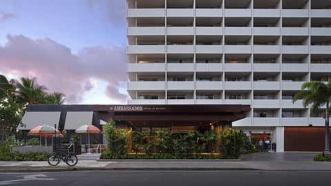 Exterior view of The Ambassador Hotel of Waikiki with tropical landscaping