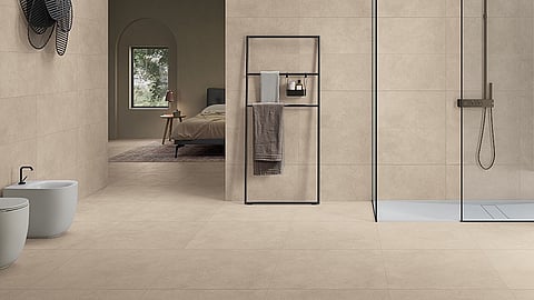 Modern bathroom with beige porcelain tiles and glass shower enclosure
