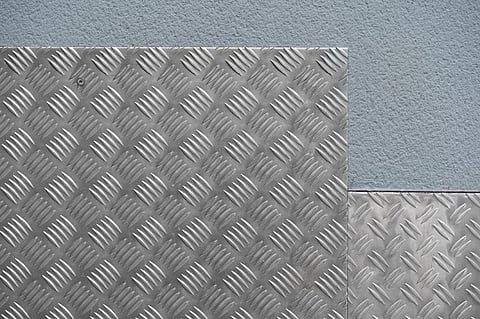 Raw Meets Refined: Using Aluminium Checker Plate Feature Panels in Loft Apartments and Gallery Interiors