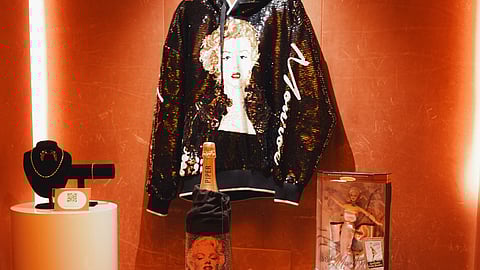 Display of Russell Young’s Marilyn-themed art and collectibles at the MM100 event