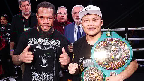 Lamont Roach Jr. and Isaac Cruz pose in the ring after their championship fight