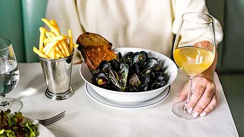 Mussels with fries and white wine served at Petit Trois Aspen
