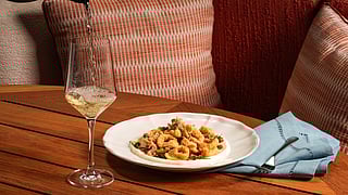 Aguasal by José Andrés Group brunch dish with wine at Andaz Miami Beach