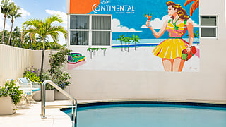 Hotel Continental outdoor pool with custom mural by Pedro Sena