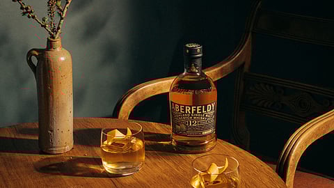 Gold Fashioned cocktail with Aberfeldy 12 Scotch on a wooden table