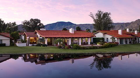 Waterfront Santa Barbara style home at La Quinta Country Club at sunset