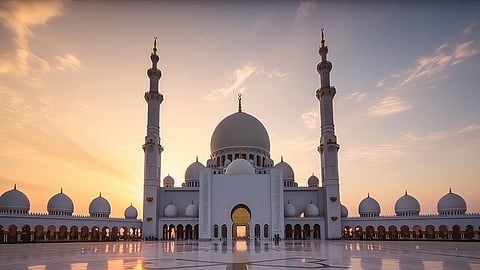 Sheikh Zayed Grand Mosque in Abu Dhabi at sunset, a landmark shaping surrounding real estate demand