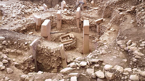 Stone pillars and circular walls within Enclosure F at Göbekli Tepe archaeological site