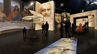 Visitors explore a Leonardo da Vinci immersive exhibition at Frost Science