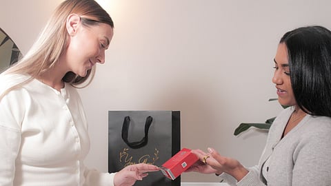 Client receives skincare product guidance at You Glow Aesthetics clinic