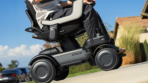 Close-up of Strutt ev¹ intelligent mobility vehicle climbing a residential slope