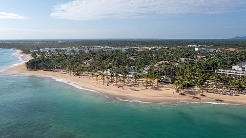 Aerial view of Wyndham Alltra Punta Cana on a turquoise beachfront in Punta Cana