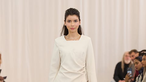 Cream pleats and sculpted draping