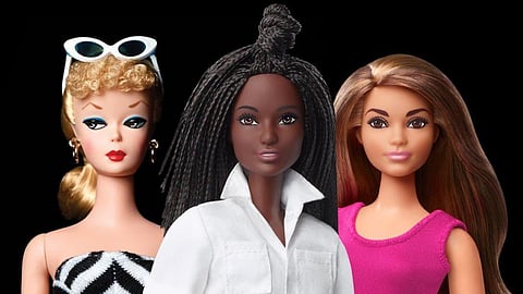 Three Barbie dolls from 1959 to today highlight evolving fashion and representation