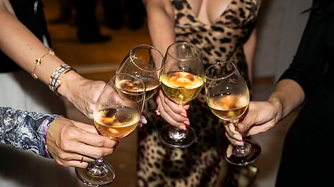 Guests clink wine glasses at candlelit Miami celebration for the Andrea Bocelli Foundation