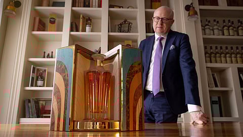 Kevin O’Gorman with the 50-year-old Irish whiskey in its wooden display case