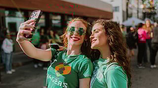 Friends taking a selfie at JohnMartin’s Annual St. Patrick’s Street Festival