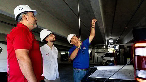 MTD Painting & Construction team reviewing structural areas during an inspection