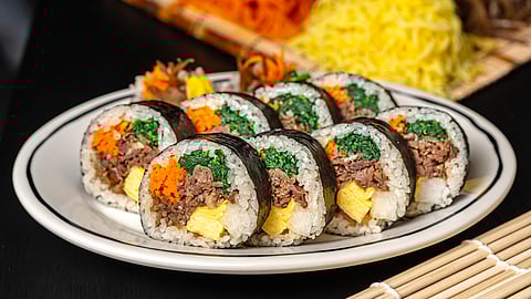 Plate of beef bulgogi gimbap with egg, spinach, and carrot at TBD Gimbap in West Village