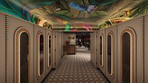 Entrance corridor to Ariya restaurant with arches, patterned floors, and vibrant ceiling mural