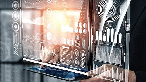 Business professional holding tablet with AI data dashboards and analytics interface