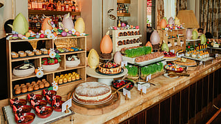 Easter dessert buffet with cakes pastries and chocolate eggs