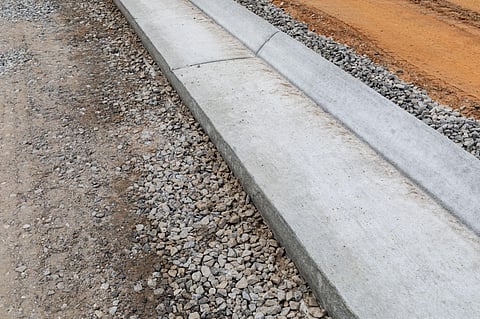 Defining Your Landscape: The Benefits of Concrete Curbing in Calgary