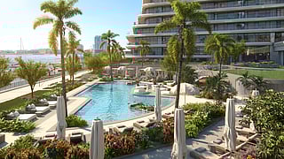 Luxury pool deck with palm trees, lounge chairs, and waterfront views in Jacksonville