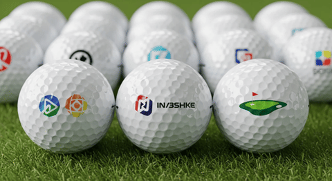 The image displays personalized golf balls featuring custom logos and branding