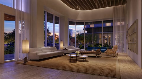 Luxury lobby interior with modern seating, tall windows, and warm ambient lighting in Miami