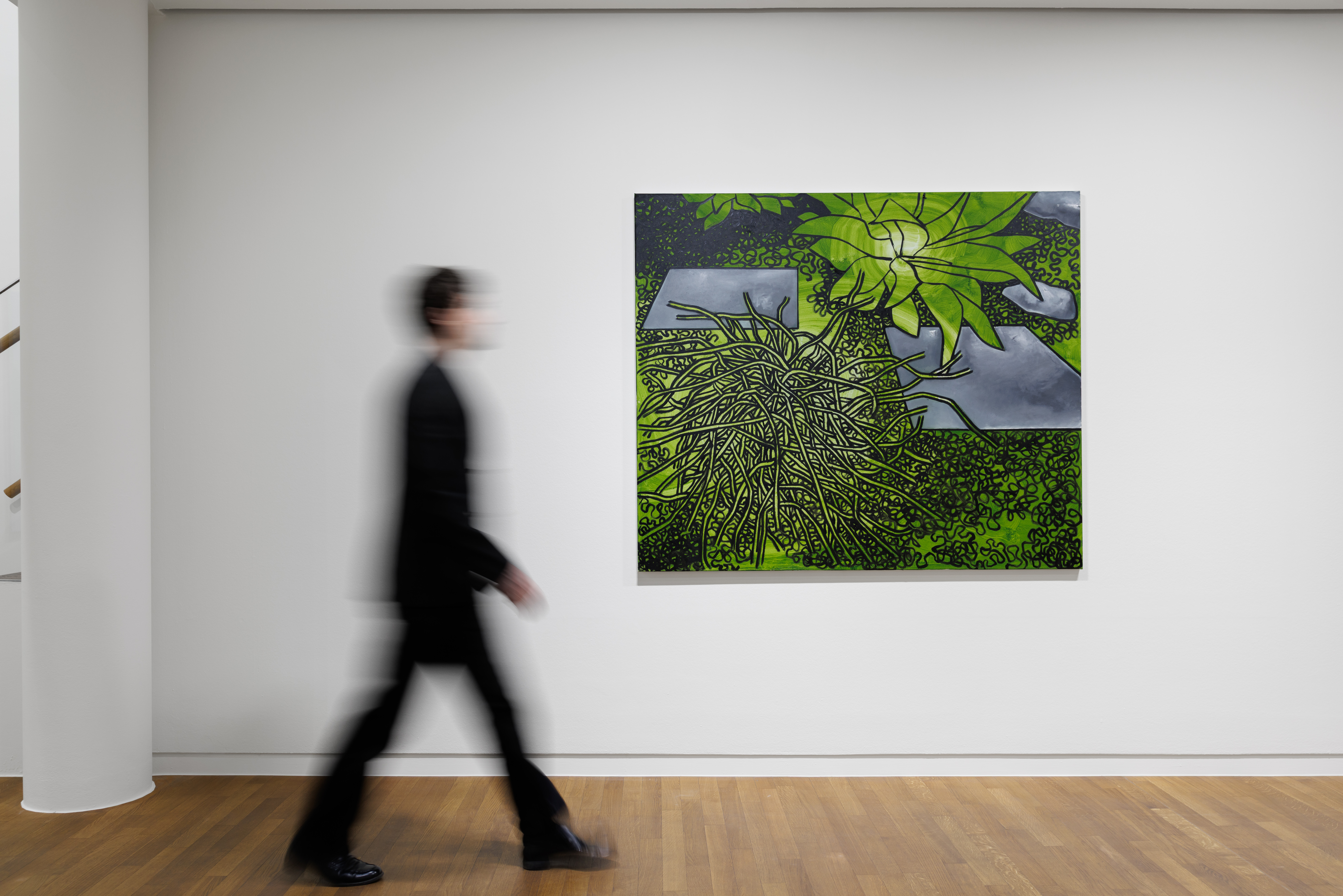 Blurred figure walking past a green-toned abstract painting in a gallery space
