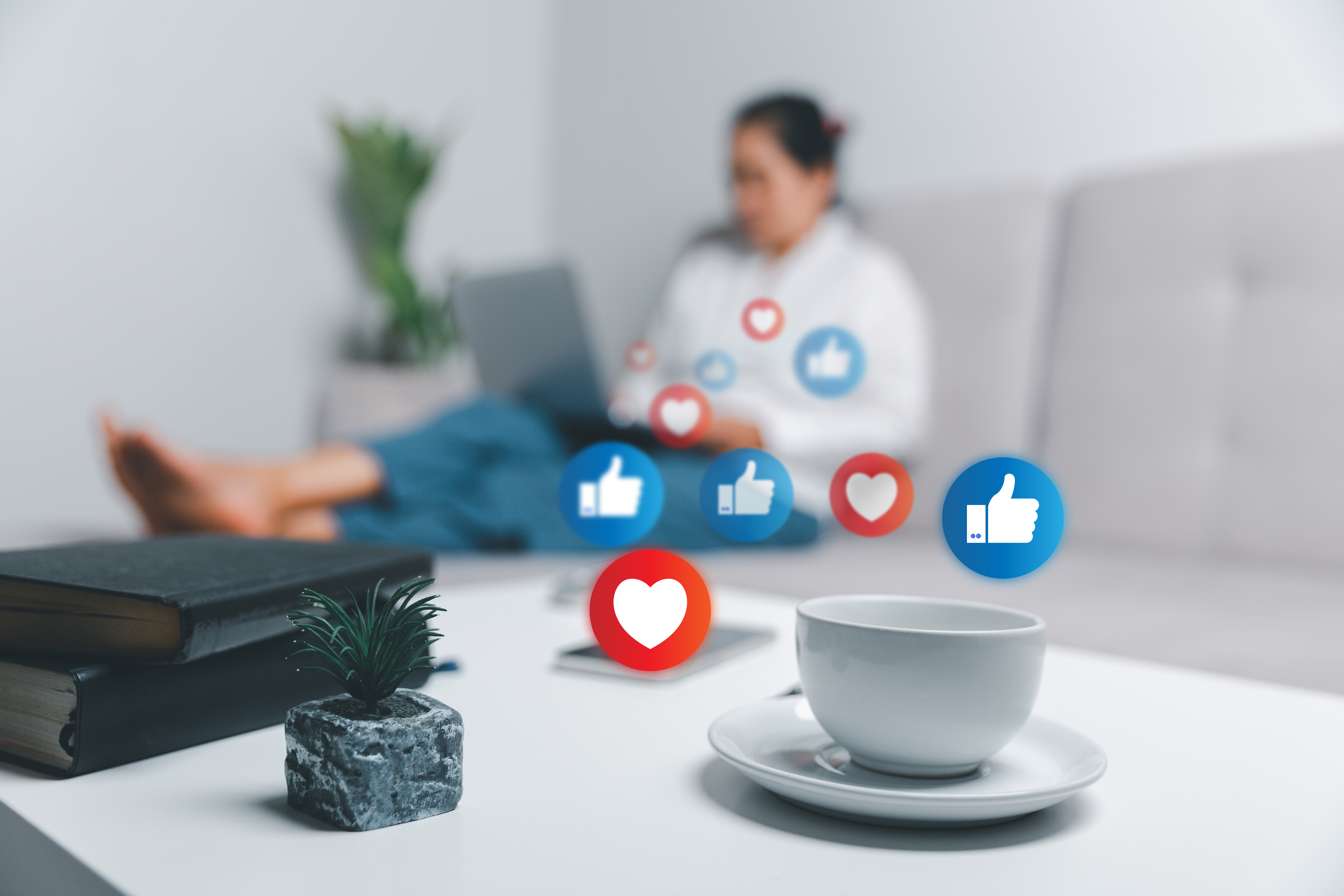 Person using laptop at home with social media icons overlay representing private browsing behavior