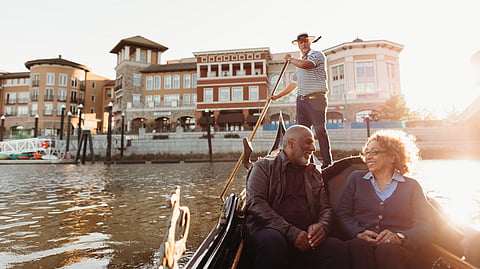 Couple enjoying a gondola ride on the Napa River at sunset