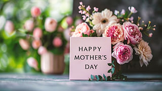 Pink Mother’s Day card with roses and florals arranged in soft natural light