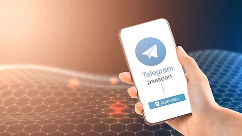 Hand holding smartphone showing Telegram Passport screen for secure login and identity verification