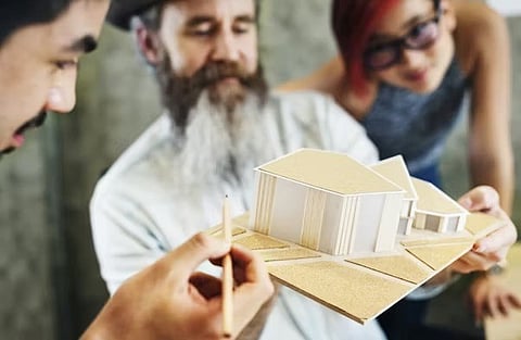 a wooden architectural model of a modern house