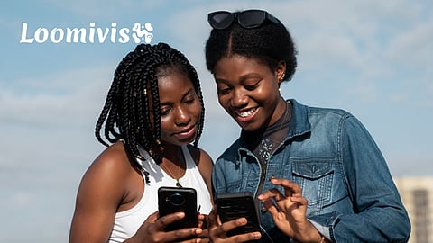 two individuals engaged in digital activities