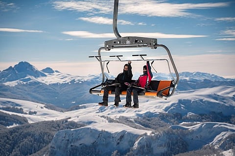 a couple on chairlift