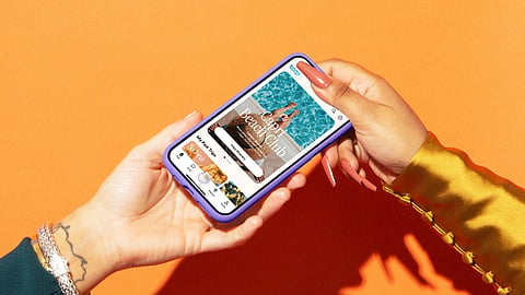 Hands hold a smartphone displaying the Boop travel planning app