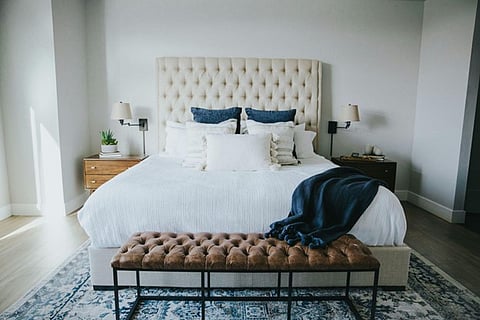 a cozy bed with cushions