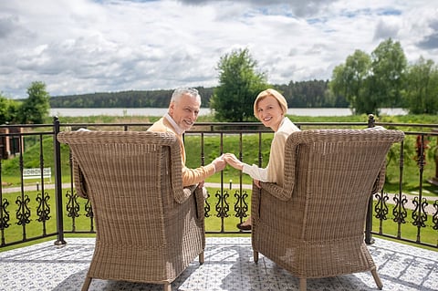 a Royal Garden Canterbury resin wicker club chair in a light brown weave