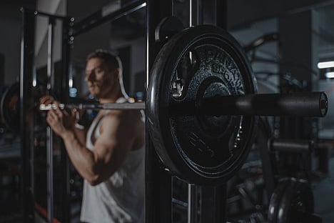 man working out on a Smith Machines from Fitness Avenue