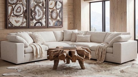 Cream modular sectional sofa in rustic luxury living room with wood accents