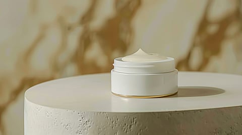Minimalist skincare cream jar on neutral backdrop with soft natural lighting