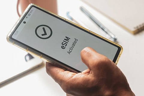 a mobile screen showing a notification that eSIM has been activated
