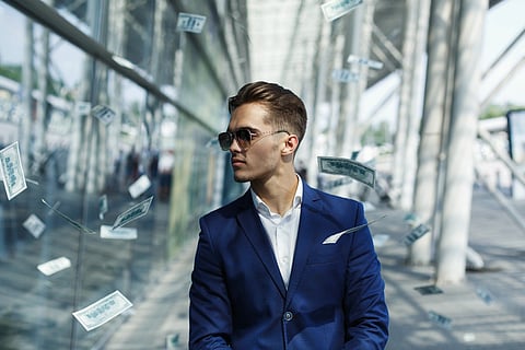 a person in a luxury navy blue suit