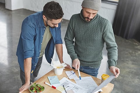 Two people engaged in a work-related discussion